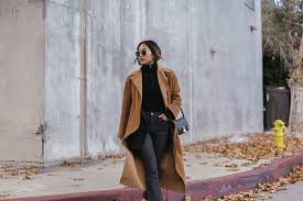 Play down the casualness of your look by wearing black leather derby shoes. All Black With A Camel Coat Song Of Style