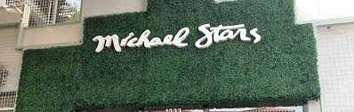 I think fake grass all the way! Michael Stars Storefront Geranium Street