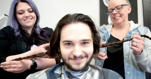A cut for a friend: lock's trimmed in support of cancer victim