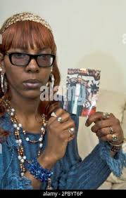 Tequea Gandy, 28, holds a 1992 photograph of her mother, Elizabeth Maxine  Gandy, Thursday, Feb. 15, 2007, in Bridgeport, Conn. Emanuel Webb was  ordered held