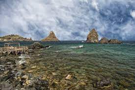 How many people live in aci castello sicily? Aci Trezza Sicily A Small Seaside Resort With The Faraglioni Nature Reserve
