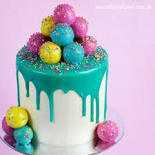 Birthday Cake With Cake Pops On Top Dripping Ganache Cake Decorated With Cake Pops For The Video Tutorial Visit Http Www Youtube Com C Rosiesdesser Drip Cakes Cake Pop Decorating Drippy Cakes