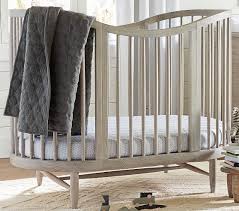 And then there are oval cribs… if you like the smooth contour of a round crib that looks great in the middle of the nursery, consider an oval crib. Broken Arrow Oval Crib Sheets Pottery Barn Kids