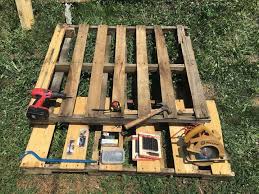 Make this pull out trash can cabinet and hide it away instead! Outdoor Garbage Can Storage From Pallets Hometalk