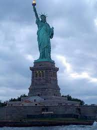 Statue Of Liberty Sits On Ellis Island New York Go To Www Yourtravelvideos Com Or Just Click On Photo For Ho Beautiful Places To Visit Nyc Trip Places To Go