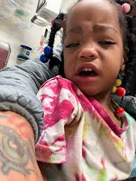 Boxer dogs standing in front of heaters and vents for warmth