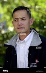 Dang Bui, boyfriend of Cau Bich Tran, leaves a San Jose, Calif.,  courthouse, Tuesday, Oct. 21, 2003, where a rare open grand jury begins to  explore the fatal July police shooting of