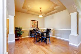 While there are a lot of ways to make your dining room look great, chair rail molding is one of the best ways to make your space elegant and stunning. Spacious Dining Room With White Columns And Beige Tray Ceiling Black Wooden Table And Chairs Set Northwest Usa Stock Photo Picture And Royalty Free Image Image 61133789