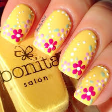 If they're applied properly with good quality products, they will make your nails look strong, healthy and the height of sophistication. Yellow Nails With Acrylic Flowers Design Idea