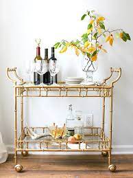 8 Stylish And Practical Essentials Every Bar Cart Should Have Bar Cart Styling Bar Cart Decor Brass Bar Cart