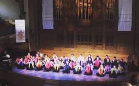 It involves solo and group singing, hand clapping, synchronized body and hand movements, accompanied by percussion instruments. Pelajar Kanada Dikir Barat