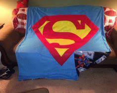 This blanket would be perfect to use while crawled up on the couch watching your favorite movie or show! 19 Superman Blankets Ideas Superman Blanket Superman Action Comics
