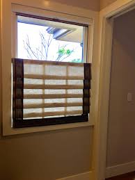 Window well covers and grates offer protection as well as style to your basement egress system. Bottom Mounted Roman Shade Covers Lower Half Of Window Window Coverings Windows Diy Window Treatments
