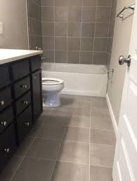 Skybridge Gray 12x12 Tile Installed Brick Joint On Floor And Walls Basement Bathroom Remodeling Bathroom Floor Tiles Bathroom Wall Tile