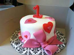 Ideas for a delicious birthday cake for girls. First Birthday And Valentine S Day Cake With Hearts And Bow 90 00 8