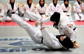 Members Of Iranian Women National Judo Team Practice While Wearing Islamic Hejab Train In Enghelab Sport Complex Sports Hijab Iranian Women Inspirational Women