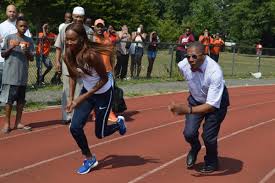 Last october, renowned hurdles coach lawrence johnson called dalilah muhammad over the phone to debrief on. Hundreds Attend Sanders Parade To Honor Olympic Gold Medal Track Star Ny State Senate