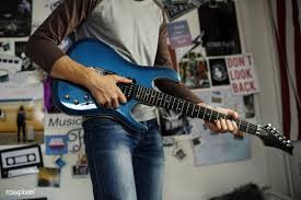 Download Premium Image Of Teenage Boy Playing An Electric Guitar In A Guitar Electric Guitar Boys Playing
