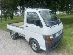 Image result for Shooting White 1964 Daihatsu