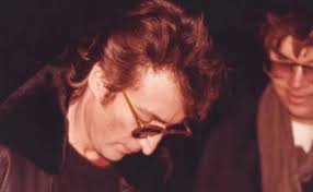 John Lennon giving an autograph to his future murderer Mark David Chapman  [1980] [611x379] : r/HistoryPorn
