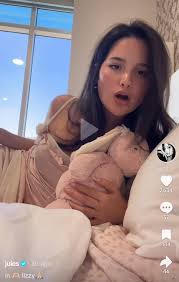 Shes a 19 year old women holding a stuffed animal trying to pose all  cutesy. Im sorry but its so weird like you are an adult grow up stop  trying to pose