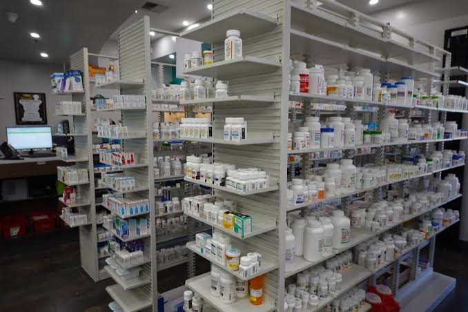 A pharmacist accepting medicine for disposal through a take-back program