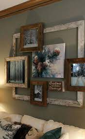 Collage Of Old Frames Makes A Rustic Eye Catching Focal Point In Your Room Rustic Apartment Decor Diy Living Room Decor Living Room Diy