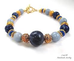 Blue Gemstone Bracelet With Gold Accents And Toggle Clasp Blue Gemstone Bracelet Blue Gemstones Gemstone Bracelet