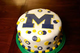 When you think of a baby shower cake, you usually envision pink or blue with perhaps a teddy bear, stroller, or floral motif. University Of Michigan Cake Bing Images Dad Birthday Cakes Football Birthday Party Trunk Party