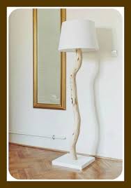Hang the plank from the ceiling and fix the jars with a bulb fixed inside them, connected with some power source and there you go. Upcycled And Luscious Homemade Table Lamps