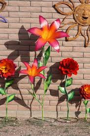 Making Metal Yard Flowers Check Back Frequently For More New Items To Be Featured Here Metal Yard Art Yard Art Tin Can Art