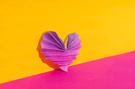 Studio Shot Of Pink And Purple Origami Heart Stock Photo