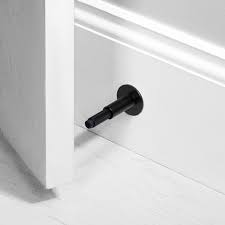 Choose a door stopper that matches your home or interior detailing. Door Stop Wall Black Buster Punch Hardware