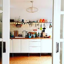 couch magazin community on instagram blick vom wohnzimmer in die kuche von elleapostroph uns gefallt wa mid century living kitchen cabinets home decor