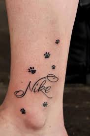 Dog paw tattoo with name. Small Name With Dog Paw Yo Tattoo