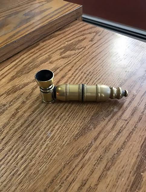 What is this small brass object from my grandfather's collection?