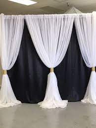 In direct light lame can be complete opaque but can be lighted to show shadows. Black Satin Backdrop With White Voile Overlays Gold Accents Gold Backdrop Black Tie Event Decorations Backdrops For Parties