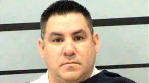 Former police chief turns self in after warrant issued for his arrest