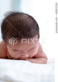 A Baby Lying Face Down Stock Photo 48061504 Pixta