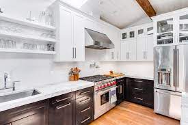 Combined with the bold marble this loft kitchen is a sight to be 34 photos white upper cabinets lower black kitchen in rvs colour photos with quick easy remodel projects that transformed our rv into brown and white color. How Can White Kitchen Cabinets Add Elegance To Your Kitchen Space