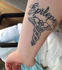It is symbolized by caduceus symbol which is comprised of two snakes. Medic Alert Tattoo Epilepsy Medical Alert Tattoo Medical Tattoo Tattoos