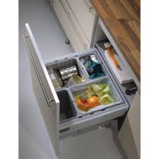This freestanding tilt out trash and recycle cabinet is a stylish way to hide the unsightly kitchen trash cans. Drawer Recycling Centers Richelieu Hardware
