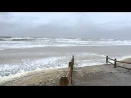 wind waves batter the shore in sea isle city