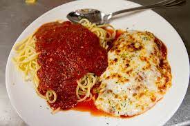 A meatlover's dream pizza is being checked for doneness. Chicken Parmesan Picture Of Lydia S Italian Kitchen Salem Tripadvisor