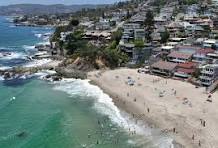 Laguna Beach Main Beach and downtown village with Ocean Avenue | arts and dining scene Laguna Beach | Susan Chase relocation guide coastal Orange County