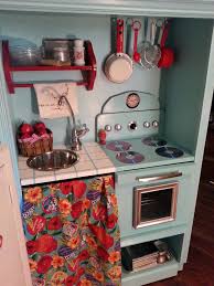 The play kitchen made out of the old tv stand is genius! Tv Stand Turned Into Play Kitchen Diy Play Kitchen Diy Kids Kitchen Kids Play Kitchen