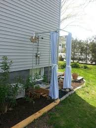 Diy Outdoor Shower Stall With Galvanized Pipes And Duck Shower Curtains Outdoor Shower Enclosure Outdoor Remodel Outdoor Shower Kits