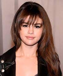 The Best Celebrity Bangs For Round Faces After Toying With Platinum For A Bit Selena Gomez Goe Long Hair With Bangs Hairstyles With Bangs Beautiful Long Hair