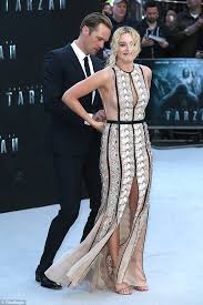 Alexander johan hjalmar skarsgård was born in stockholm, sweden and is the eldest son of famed actor stellan skarsgård. Alexander Skarsgard Helps Margot Robbie With Her Dress At Legend Of Tarzan London Premiere Daily Mail Online