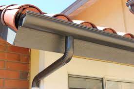 Seamless Aluminum Half Round Rain Gutters With Dual Colored Round Downspouts This Rain Gutter Installation Was Co Gutters Diy Gutters Rain Gutter Installation